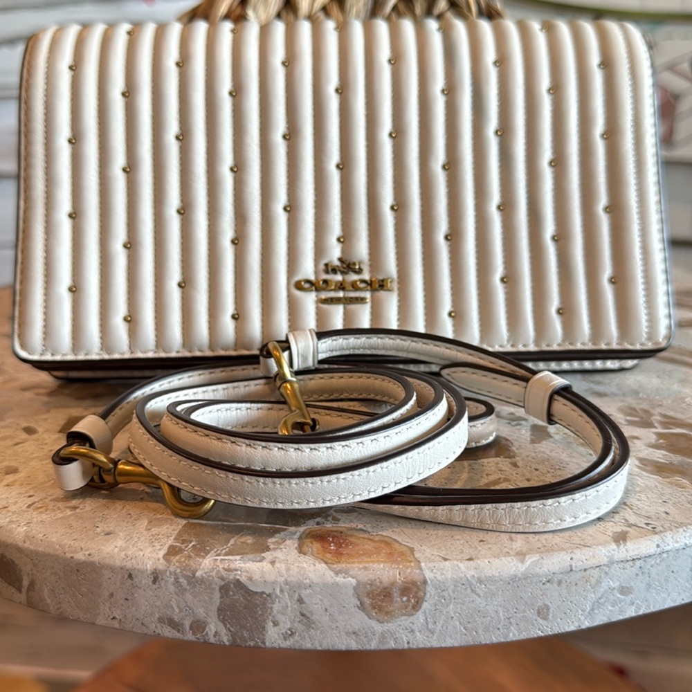 Coach ivory leather Crossbody with gold in laid pebbles.